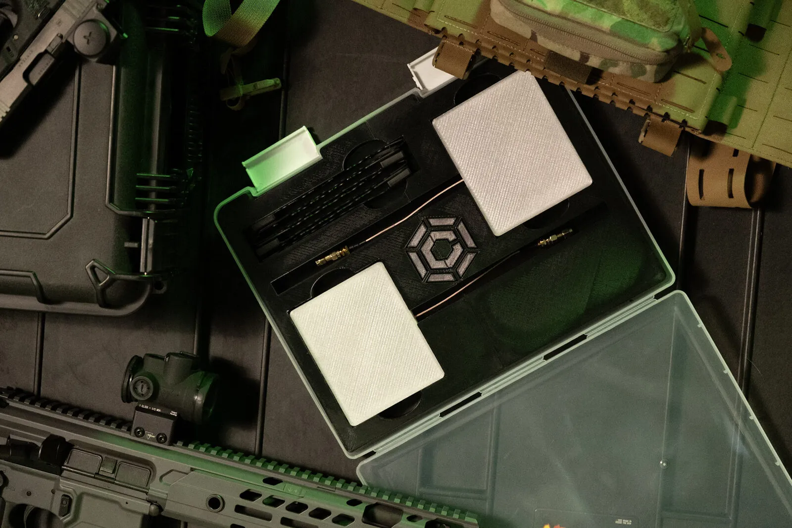 Carbon ISR evaluation kit in a hard case: conformal antenna elements, coaxial leads and connectors in a cut foam tray
